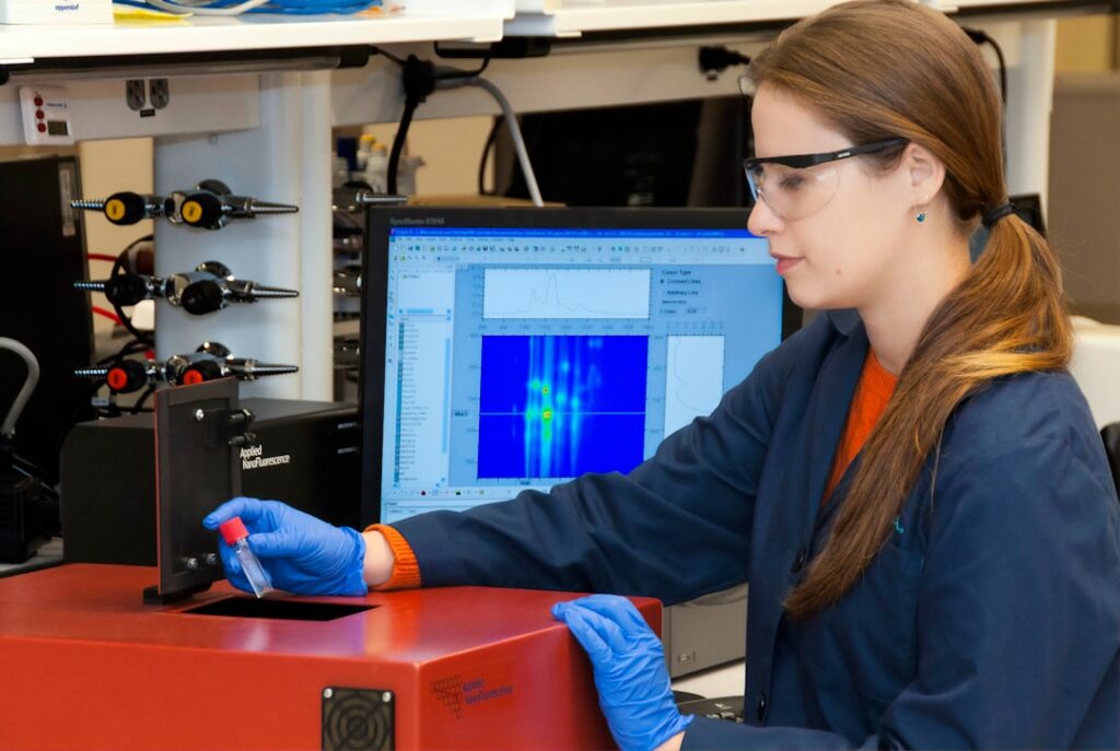 zipwp-image-ccf83bivy3q A technician using a nano-spectralizer (fluorescence microscope) at the Advanced Technology Research Facility (ATRF), Frederick National Laboratory for Cancer Research, National Cancer Institute.
